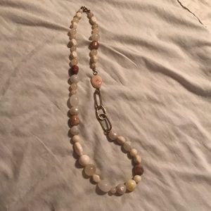 Beaded necklace with adjustable length closure.